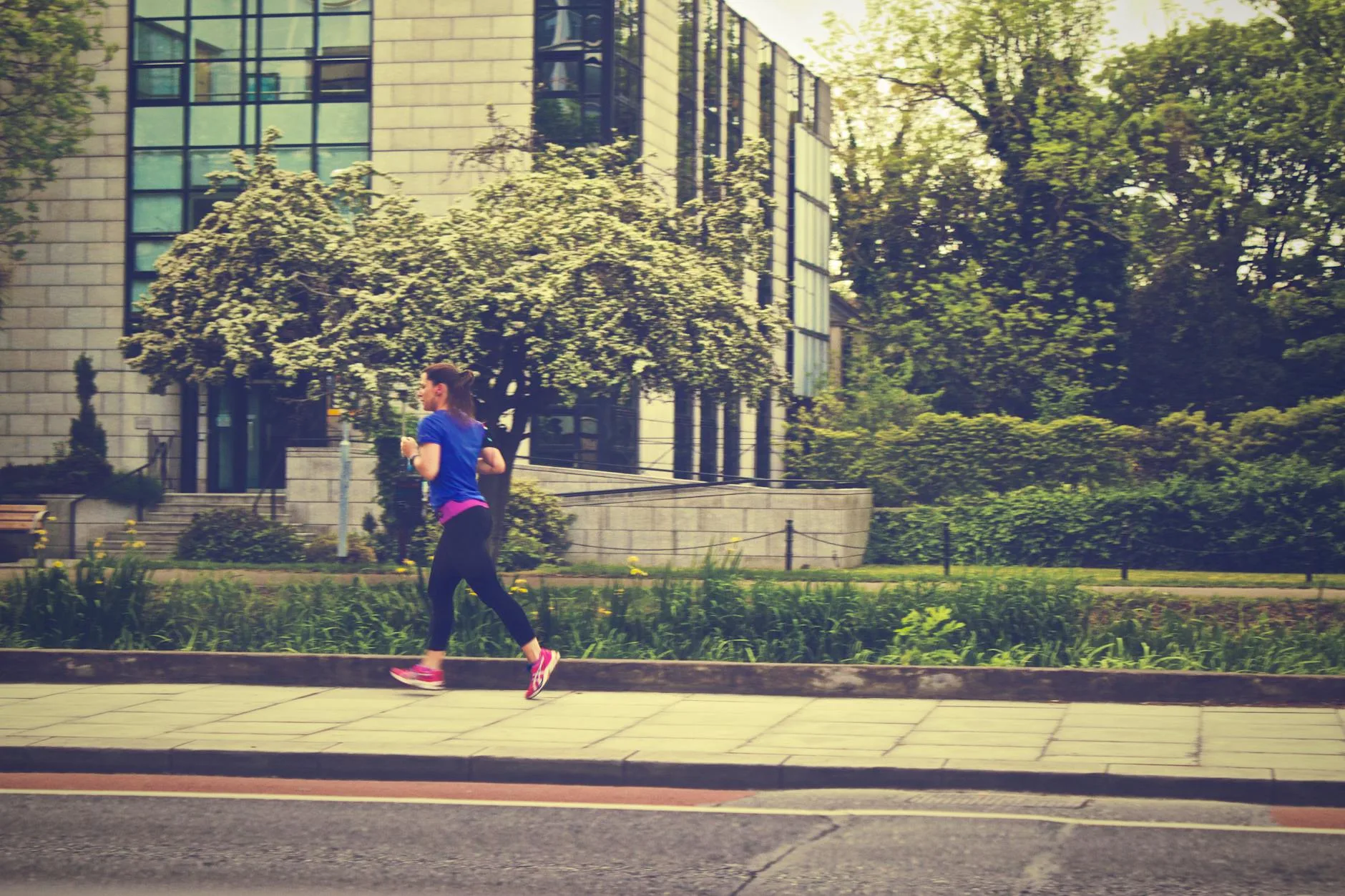 Runner studying a weekly training schedule on a clipboard outdoors