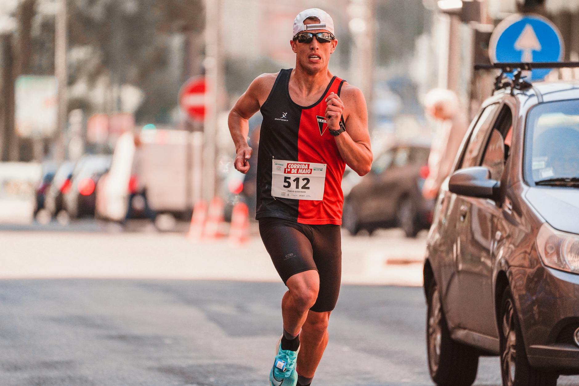 Runner fueling mid-race with energy gel during a half marathon