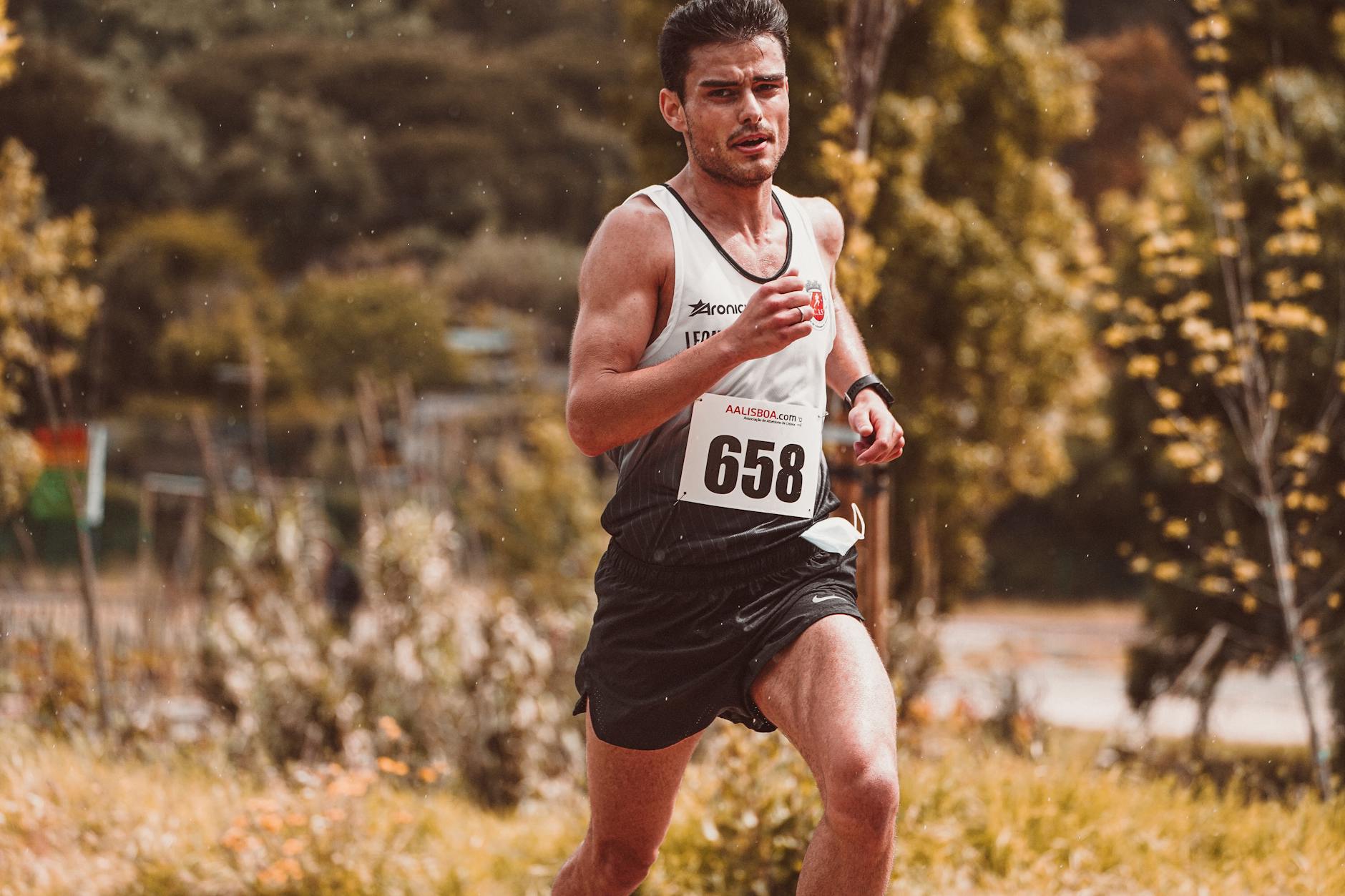 Runner sprinting on track during high-intensity interval training session