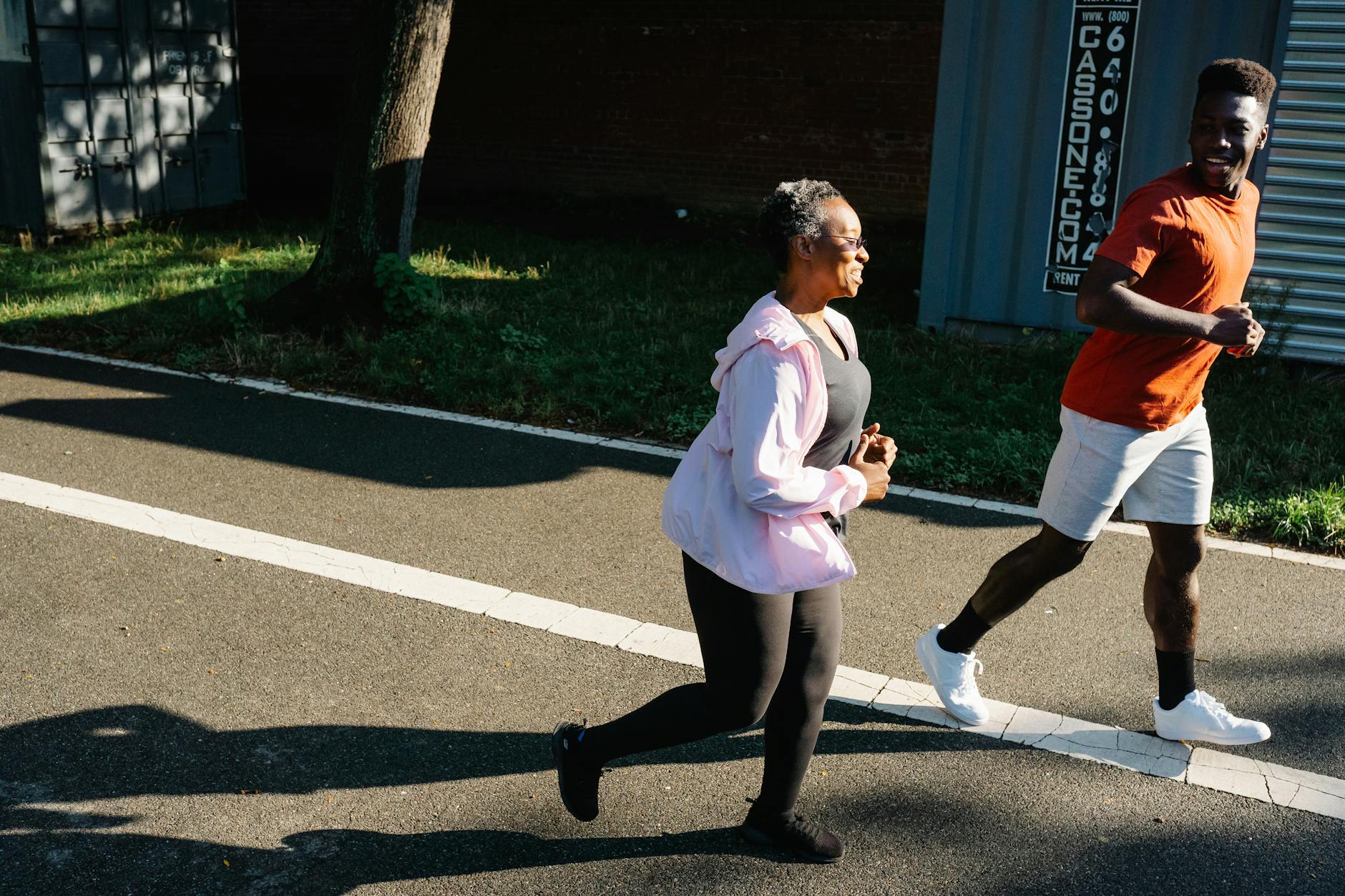Runner on trail at sunrise, focused stride reflecting weight loss journey progress