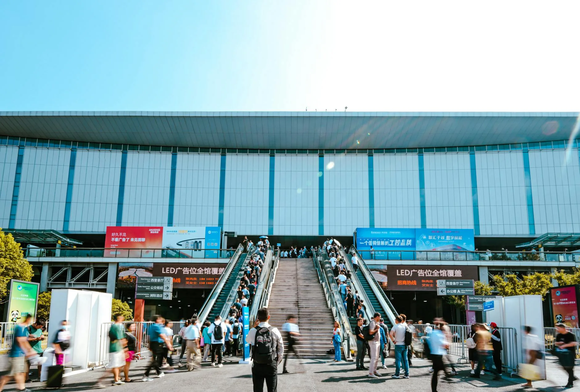 Runners browsing race-day gear and bib pickup booths at a bustling marathon expo