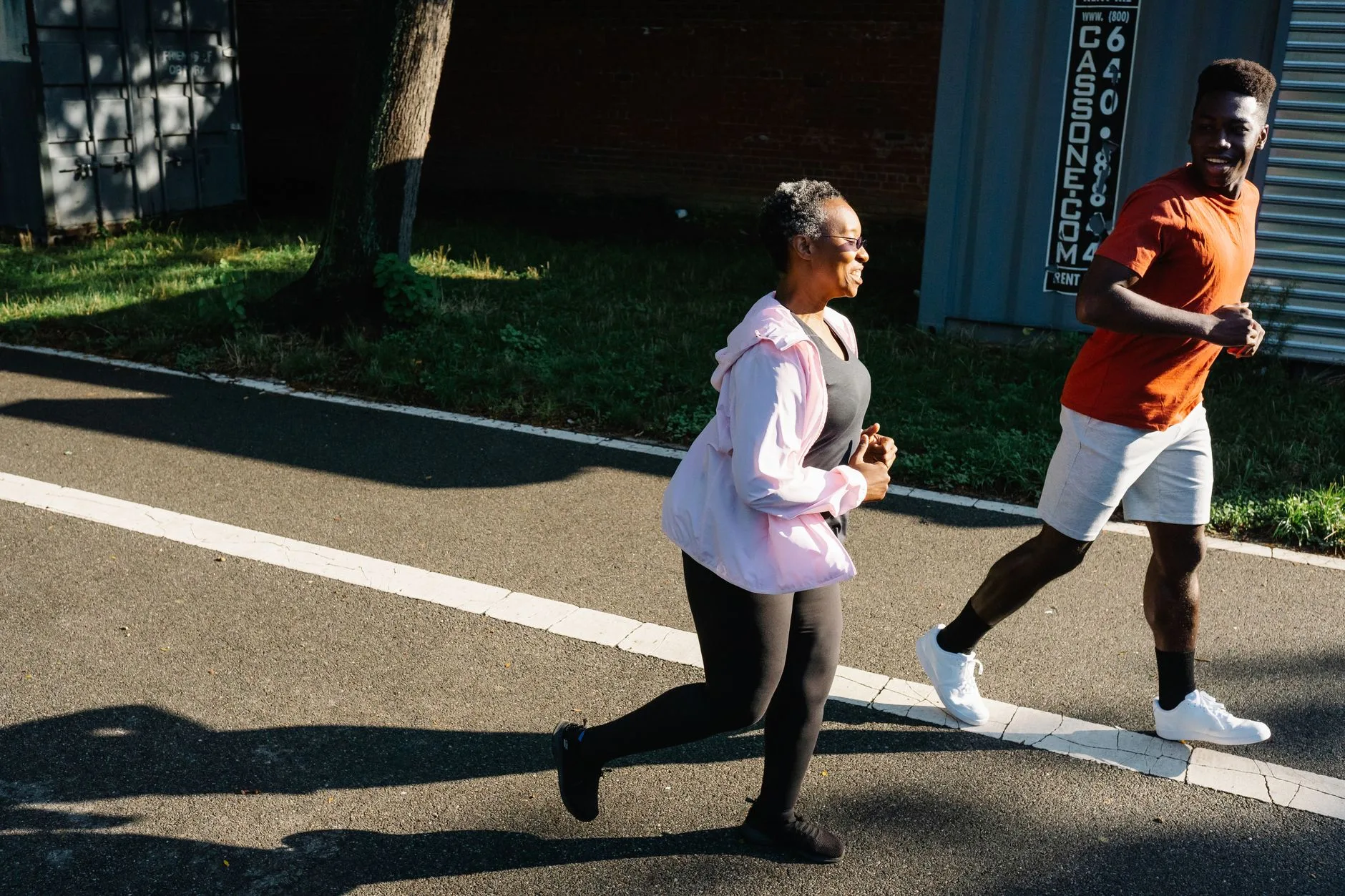Person running outdoors on a trail, working toward weight loss fitness goals