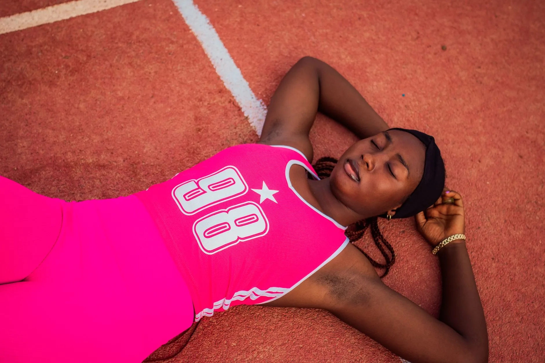 Runner stretching on a park bench during a scheduled rest day recovery