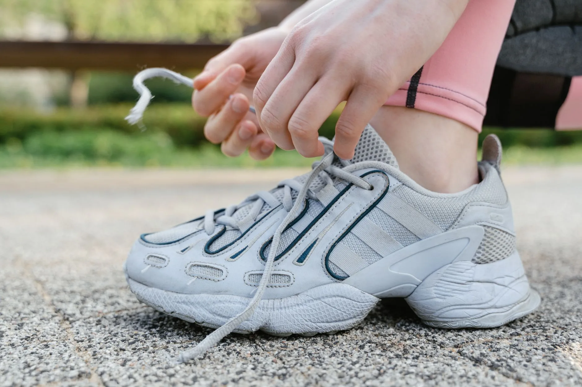 Runner with flat feet wearing supportive motion control shoes on a UK trail path