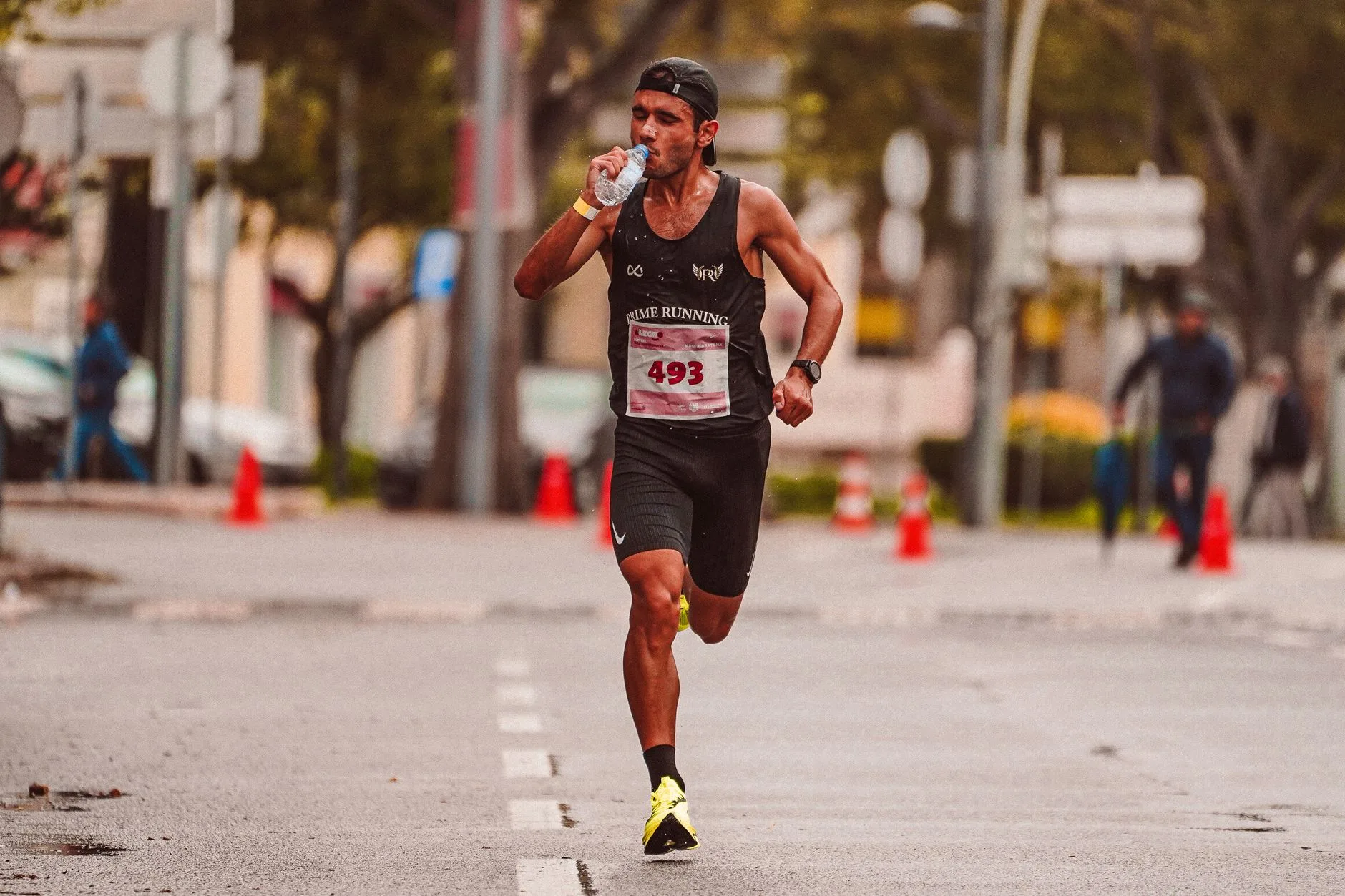 Runner stretching post-marathon with calendar overlay showing weekly recovery milestones