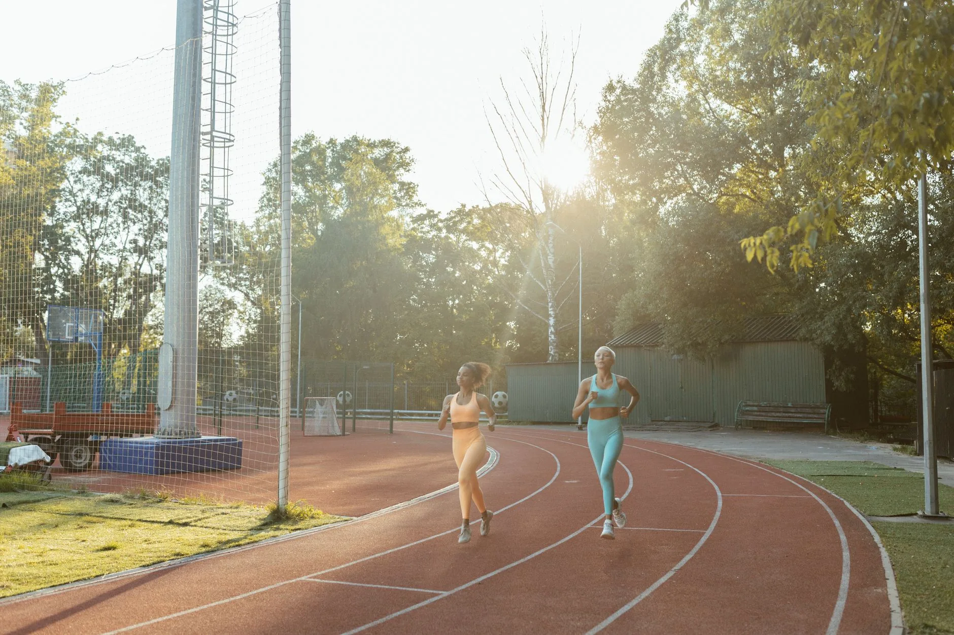Runner jogging daily on a park path, illustrating everyday running benefits and risks