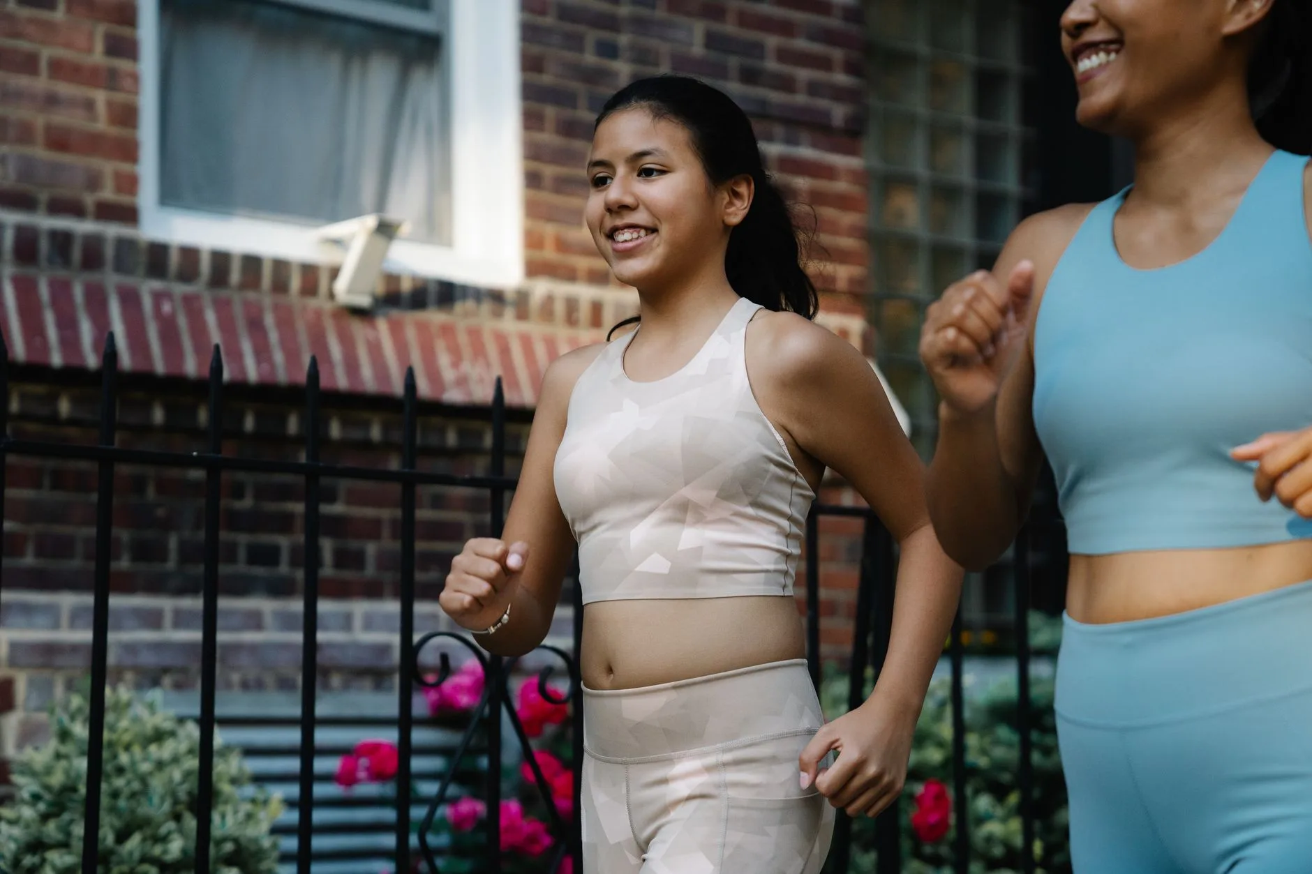 Runner breathing rhythmically while jogging outdoors, demonstrating proper running technique