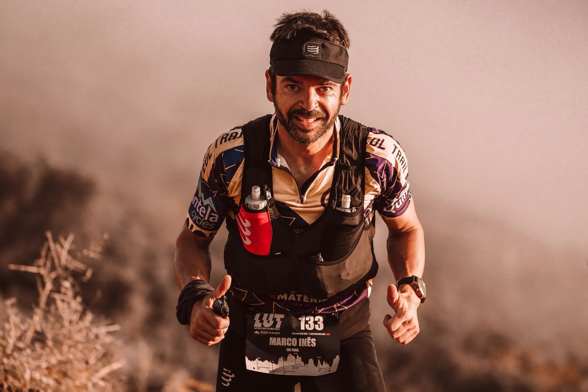 Trail runner climbing a mountain path during ultramarathon training session